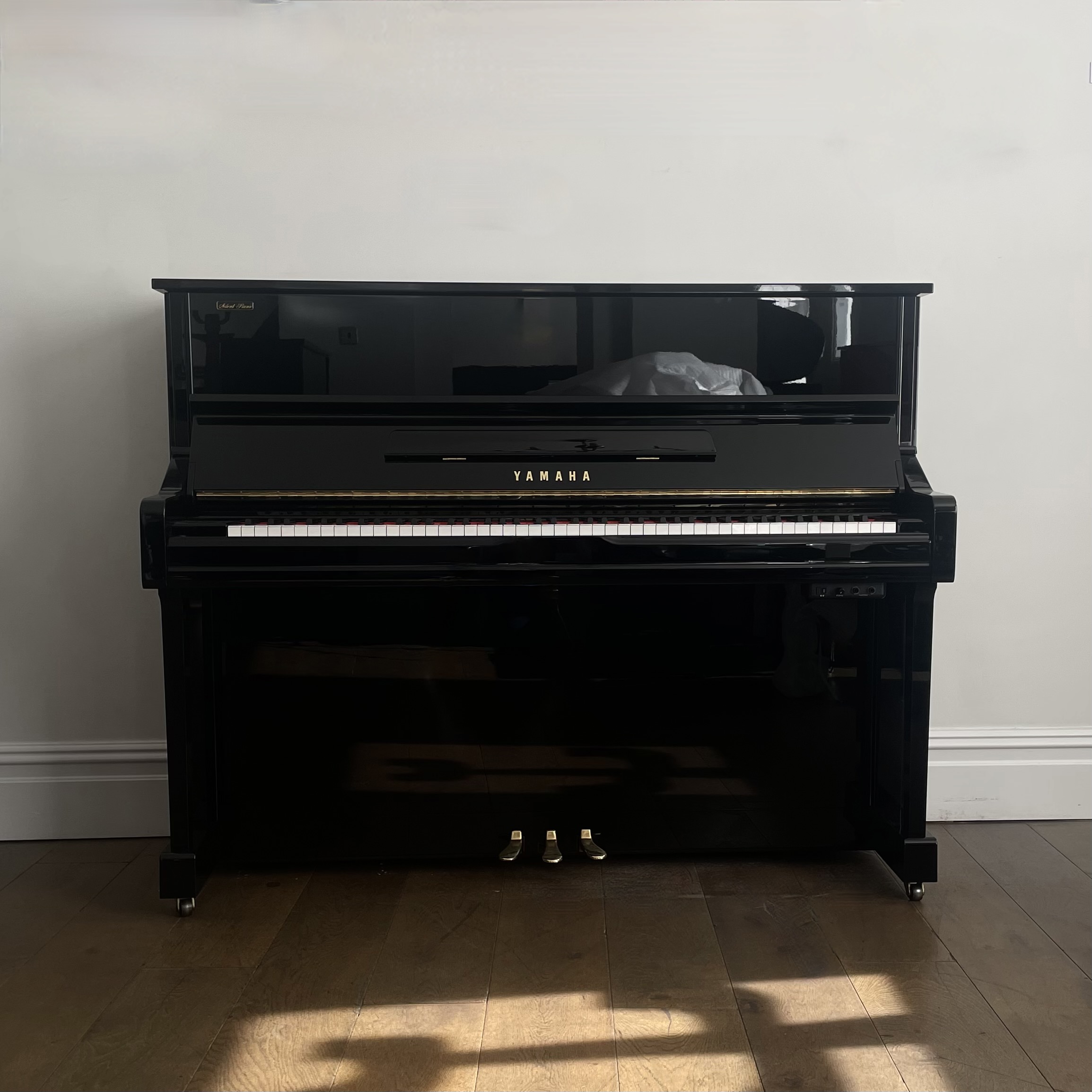 A Yamaha YU1 Silent Upright Piano