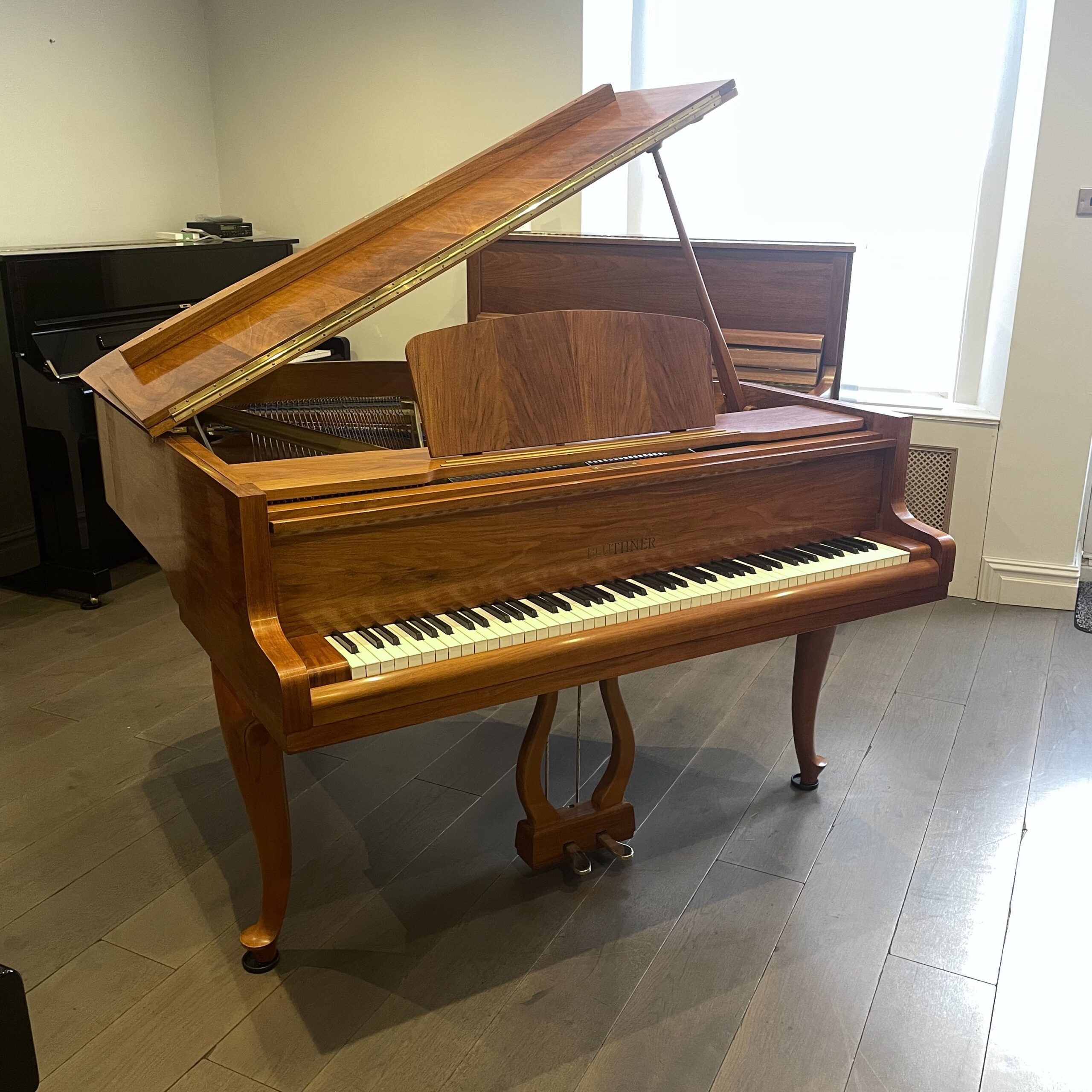 A Bluthner Grand Piano