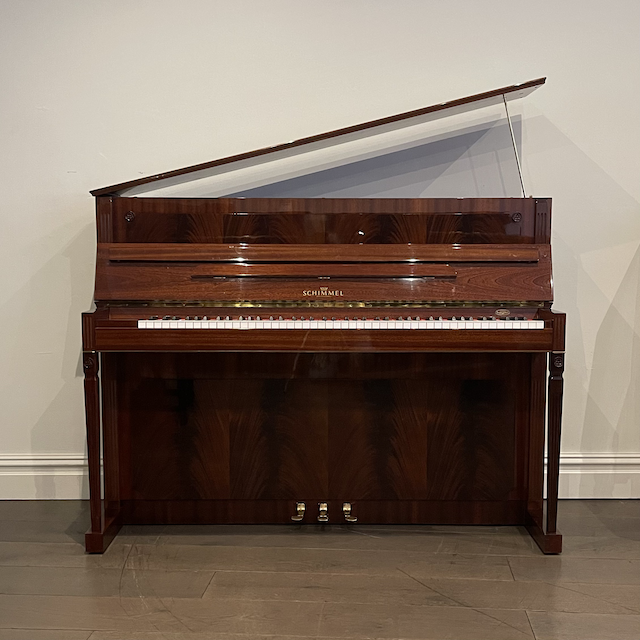 A Schimmel Empire Upright Piano