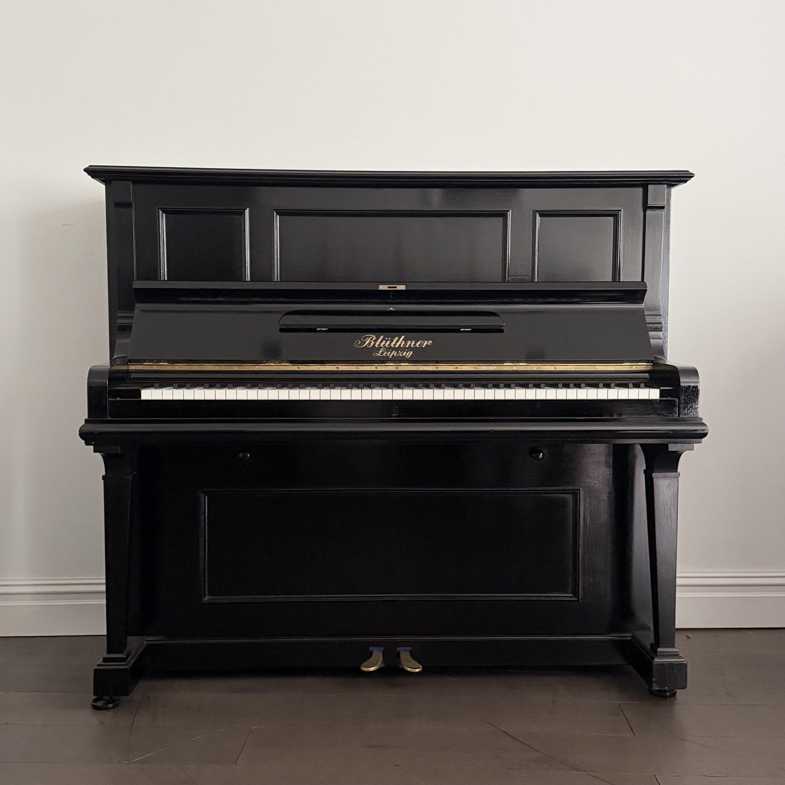 A Bluthner Upright Piano