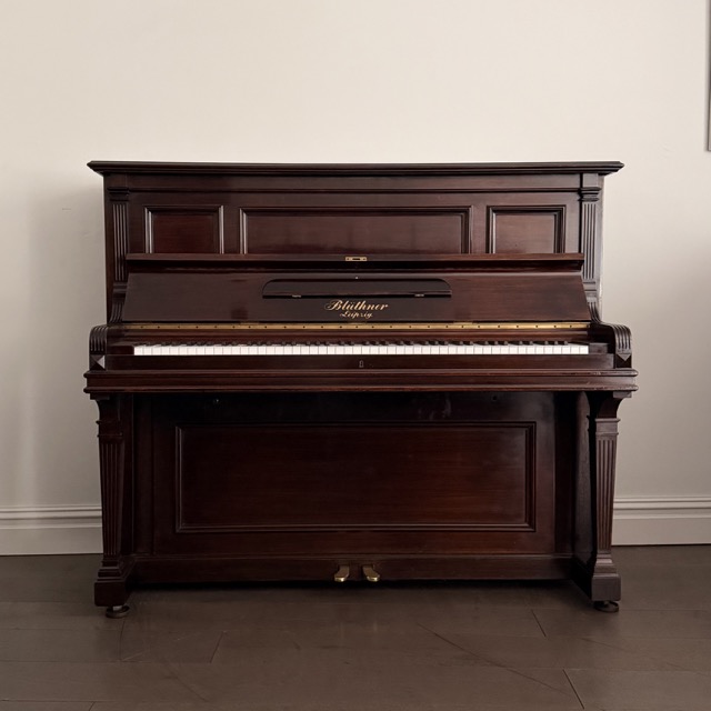 A Bluthner Upright Piano